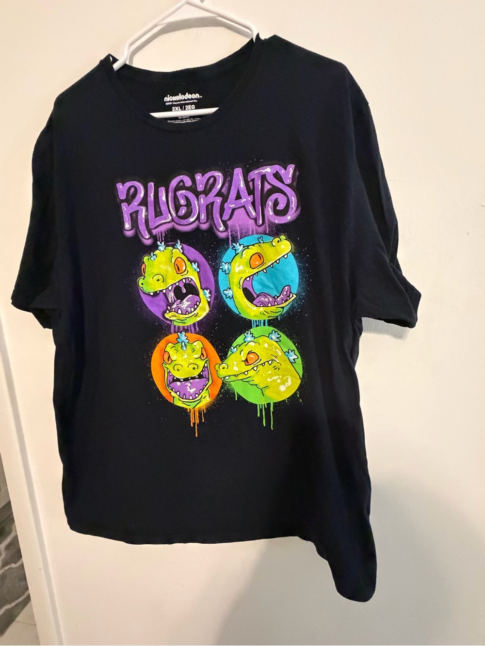 Nickelodeon Black Tee with Neon Purple, Green, Blue & Orange Rugrats Dino Art